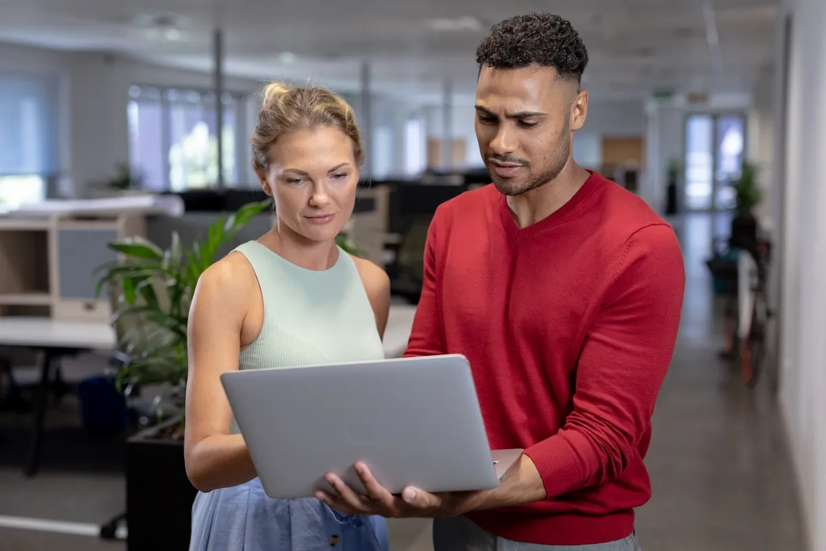 Business IT technician working with office worker at commercial offices in Montclair